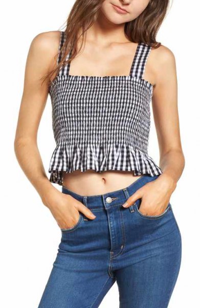 black checked frilled top with a square neck and blue jeans