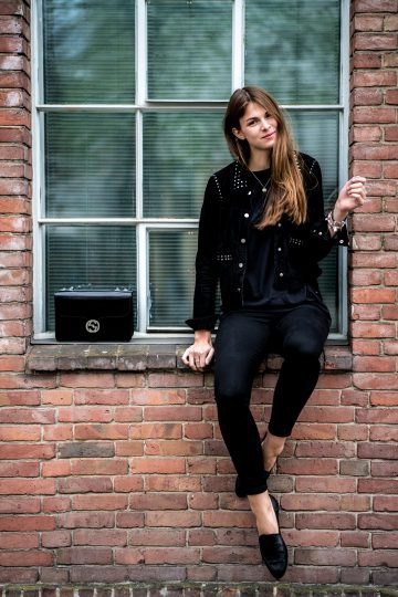black biker jacket with rivets, skinny jeans and leather shoes