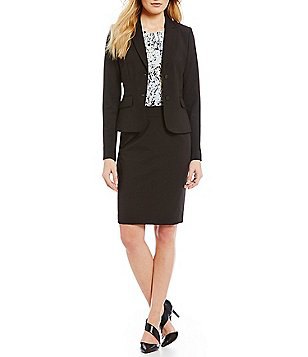 black suit consists of a short coat and pencil skirt