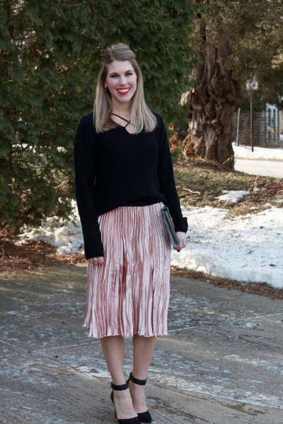 black sweater with rose gold colored midi pleated skirt