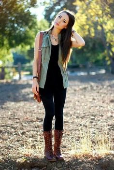black tank top with matching skinny jeans and lace-up boots in the middle of the calf