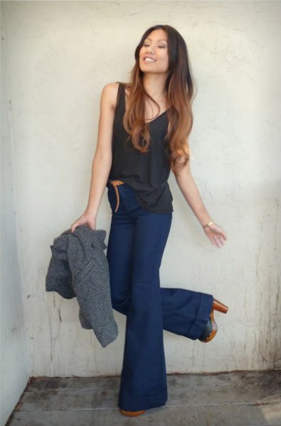 black tank top with dark blue, high-waisted, flared jeans