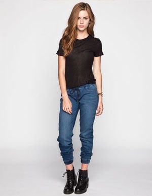 black t-shirt with shortened dark blue jogger jeans