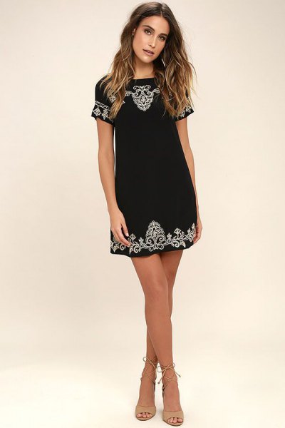 black embroidered short-sleeved mini dress with tribal pattern