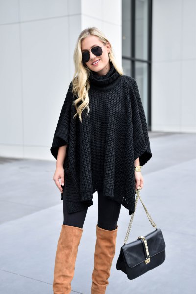 black turtleneck sweater with cable pattern and camel overknee boots