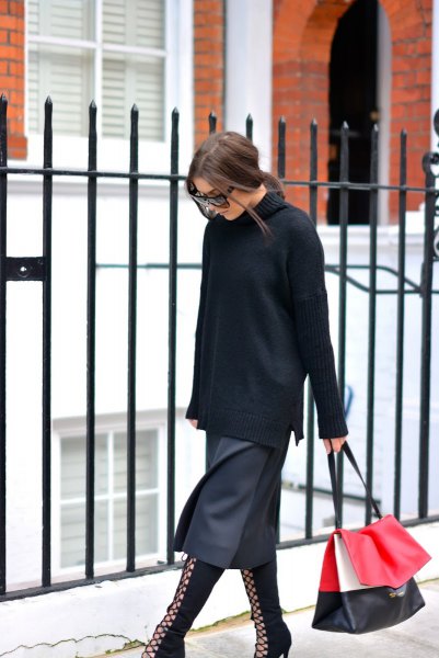 black turtleneck with a gray midi skirt and boots