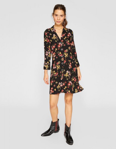 black mini long-sleeved dress with floral pattern and V-neckline and leather boots