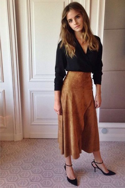 black long-sleeved blouse with V-neck and flared maxi skirt made of brown suede