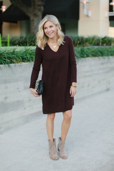 black knee-length shift sweater with V-neck and gray boots
