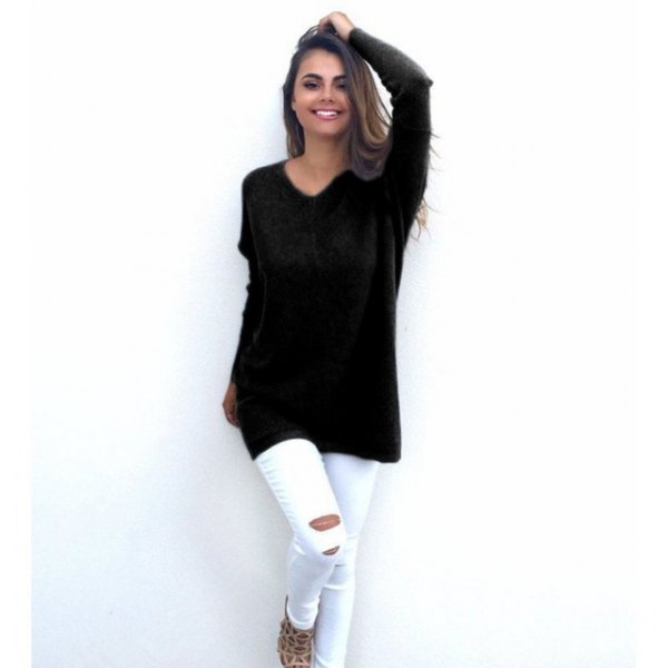 black tunic sweater with V-neck and white skinny jeans