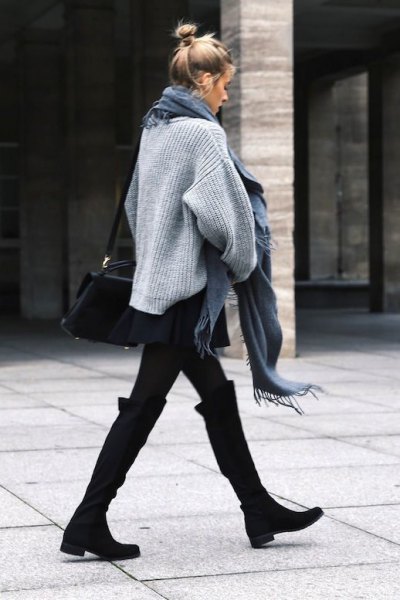 black knee-high boots with wide calves, gray knitted sweater