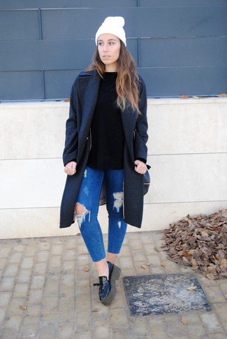 black wool coat with blue ribbed slim fit jeans and leather loafers