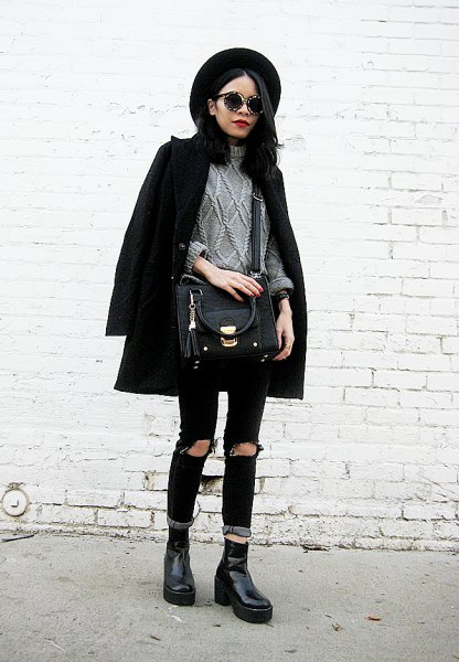 black wool coat with gray knitted sweater and ripped jeans