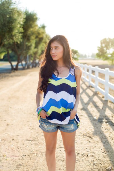 blue and light yellow tank top with zigzag print and mini jean shorts