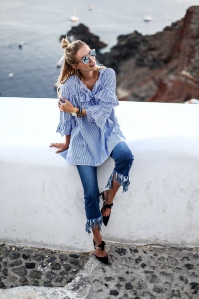 Blue and white striped bell-sleeved shirt with shortened fringed jeans