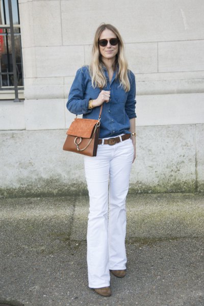 blue chambray shirt with buttons and white jeans with a bell bottom