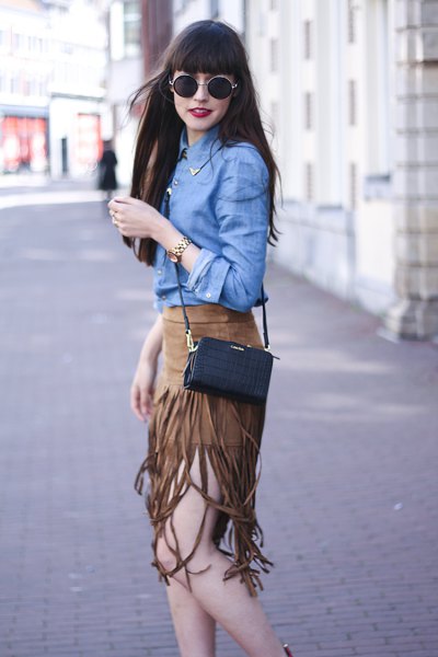 blue chambray shirt with green suede fringed skirt