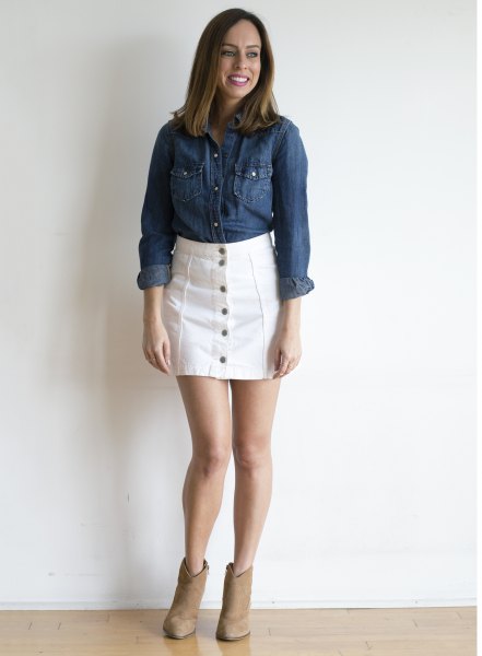 blue chambray shirt with white jeans button on the front of the skirt