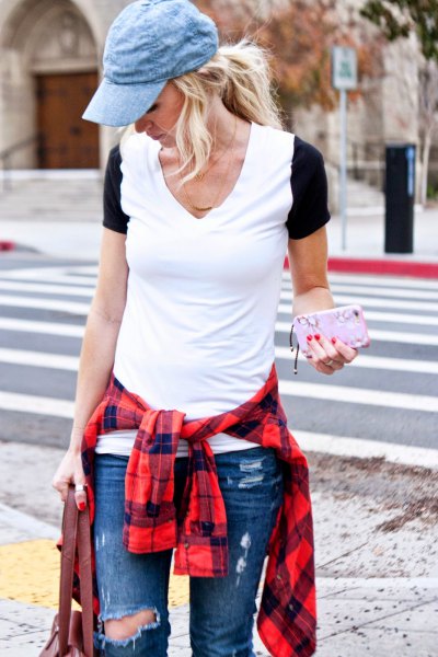 blue denim hat with ripped blue jeans and red plaid shirt