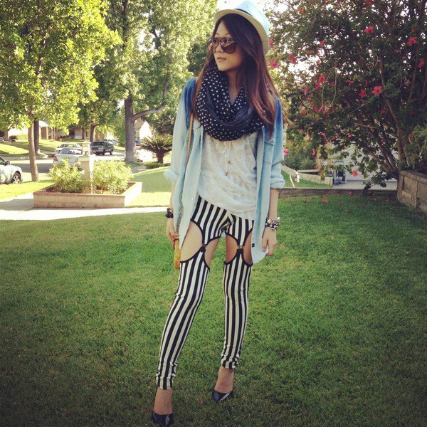 blue denim jacket with black and white vertical striped leggings