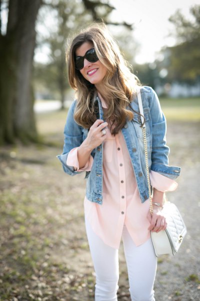 blue denim jacket with a blushing silk blouse and white jeans