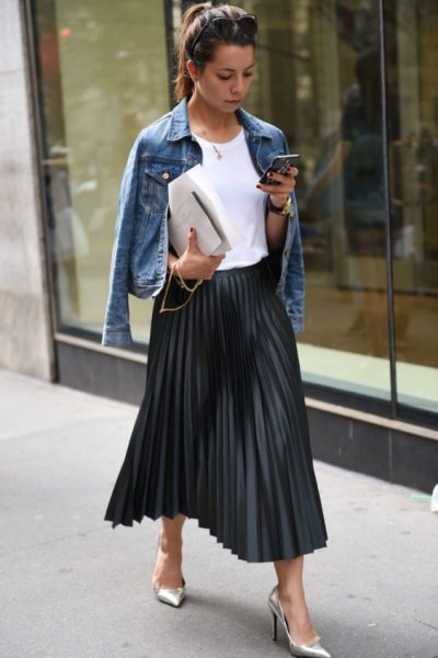 blue denim jacket with black pleated skirt in maxi