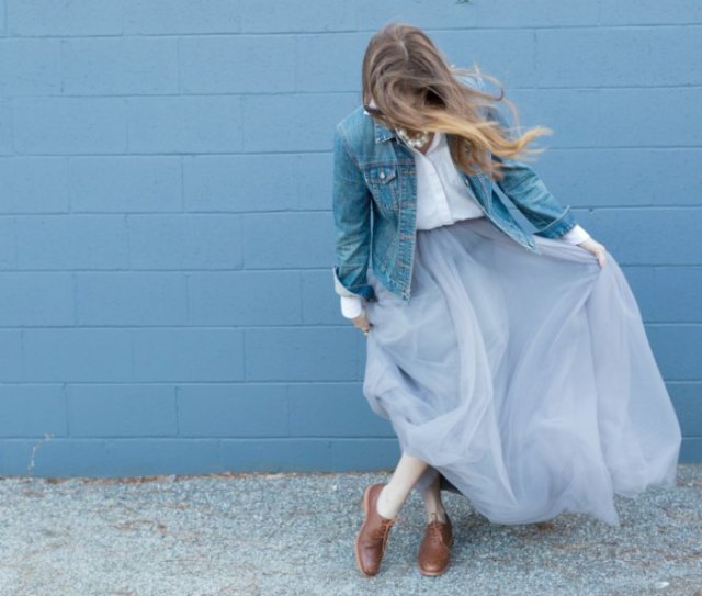 blue denim jacket with white shirt and light blue tulle maxi skirt