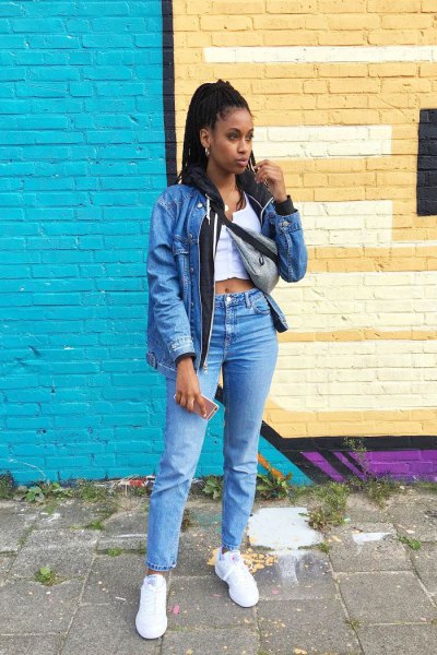 blue denim jacket with white, short vest top and high jeans