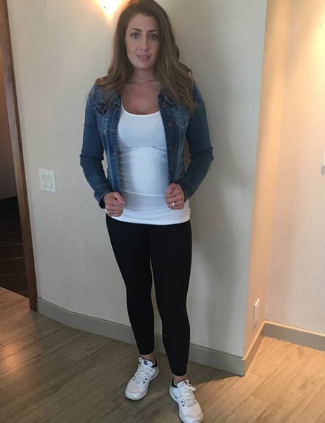 blue denim jacket with white, figure-hugging tank top and leggings