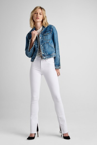 blue denim jacket with white, high-waisted, cut jeans and black heels