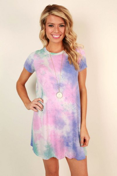 blue short-sleeved t-shirt dress with tie dye and necklace in boho style
