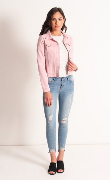 Rouge denim jacket with a white crew neck sweater and light blue jeans