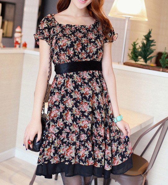 knee-length dress with pink and black belt and floral pattern