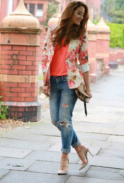 blushing pink floral blazer with an orange tank top and ripped jeans