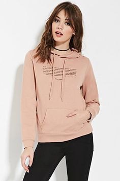 blush pink graphic sweater with black skinny jeans and choker