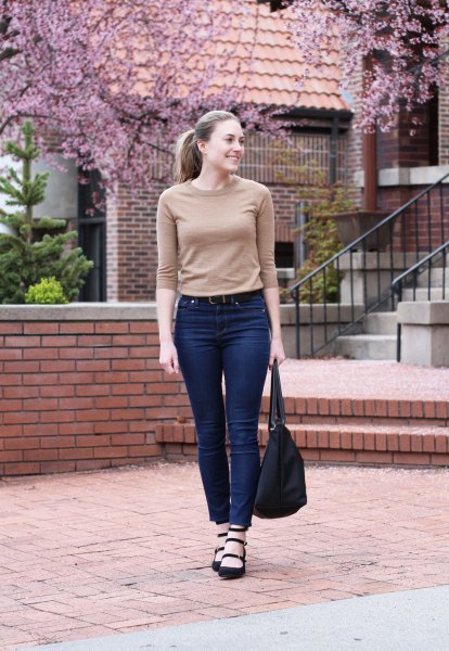 blushing pink cashmere half-sleeve sweater and high-waisted blue jeans