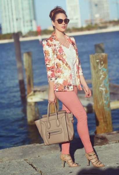 blushing pink jacket with white ruffled top and crepe skinny jeans