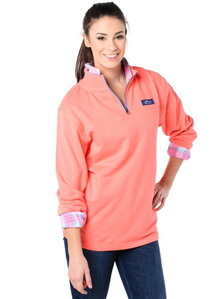 Blushing pink long-sleeved polo sweater with a gray and white checked shirt