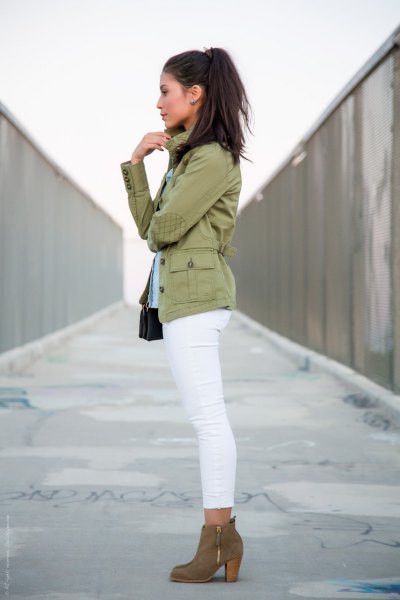 blushing pink military jacket with white skinny jeans and camel boots
