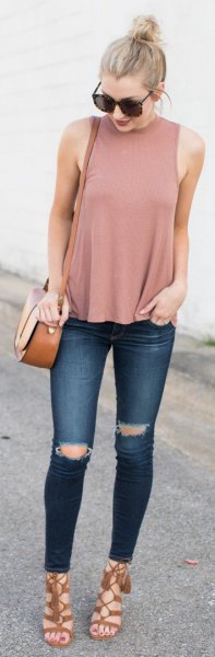 blushing pink tank top with stand-up collar and dark blue jeans