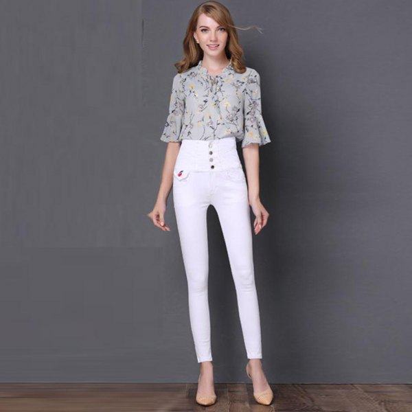 Blush pink printed chiffon bell-sleeved blouse with white button placket and high-waisted jeans
