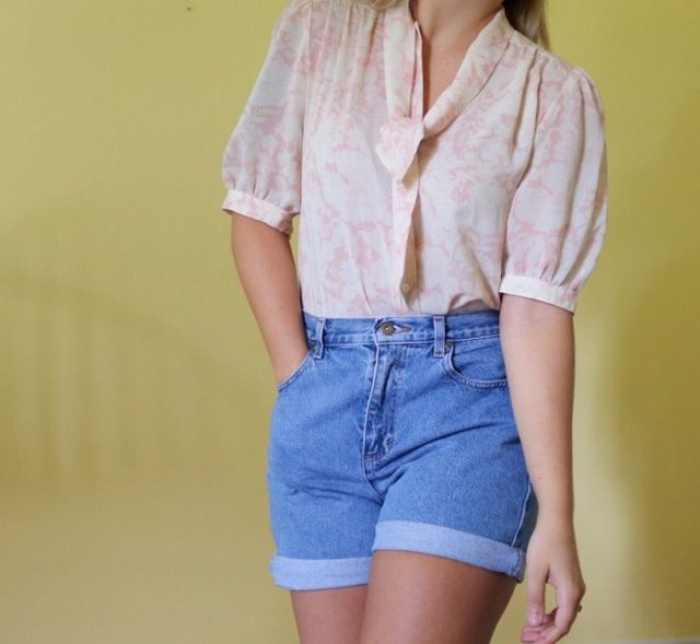 blushing pink puff sleeve blouse with high-waisted jeans