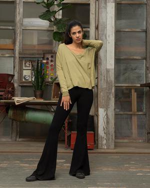 Blush pink long t-shirt with relaxed fit and black flared pants