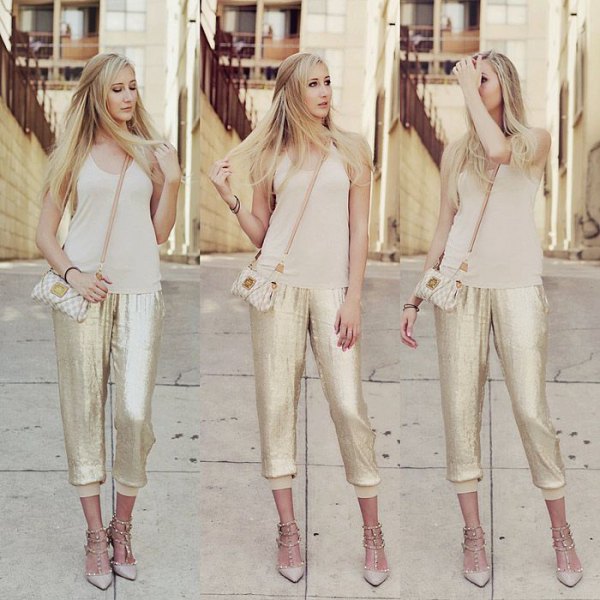 blushing pink tank top with a scoop neckline and gold sequined jogger pants