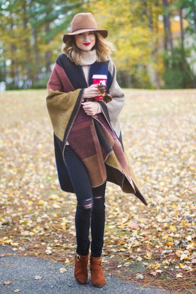 Wrap sweater in brown and navy blue with floppy hat and skinny jeans