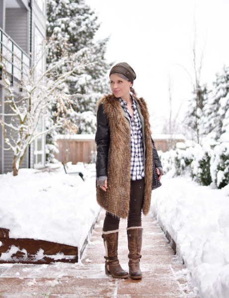 brown faux fur longline vest with black fleece leggings and a checked shirt