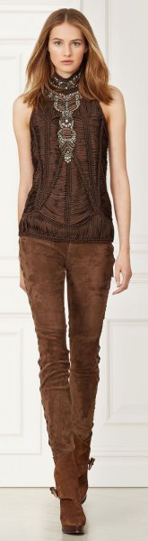 brown halterneck top with skinny jeans made of suede
