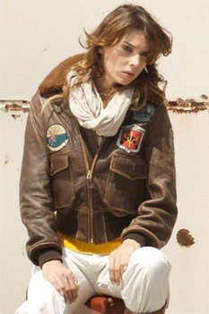 brown leather jacket with white linen pants