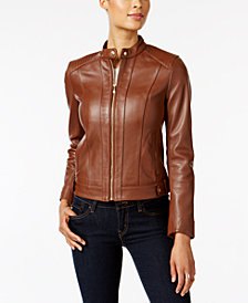 brown leather aviator jacket with black skinny jeans