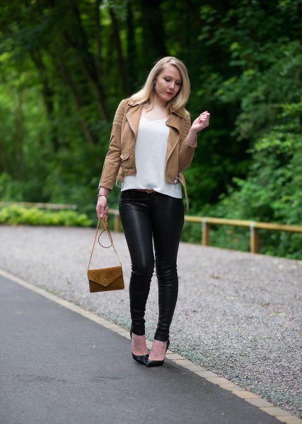 brown leather jacket with white t-shirt with scoop neck and black leggings